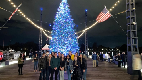 Nate Pucci with the PBPL 85 Class in D.C. in front of a Christmas Tree
