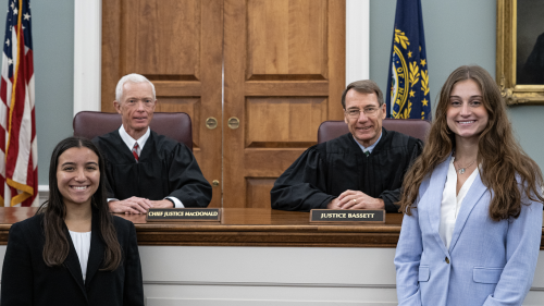 Chief Justice MacDonald and Justice Bassett with students Jessica Chiriboga '24 and Skylar Wiseman '24