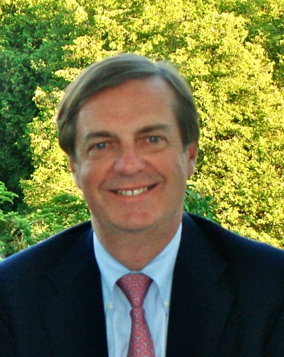 Photo of Patrick Martin outside. He is wearing a suit.