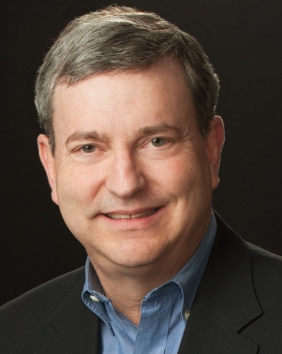 Headshot of Howard Morse. He is wearing a blue shirt under a suit jacket.