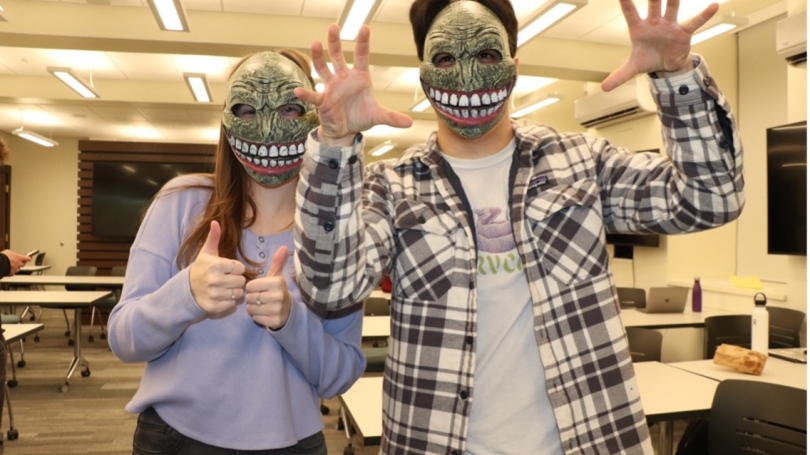 Paige Pattison '24 and Ben Spears '27 wearing masks that served as props during trial.