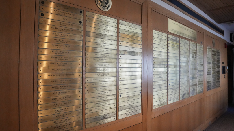 A photo of the Class of 1930 wall filled with plaques.