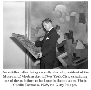 Rockefeller examining a painting. 