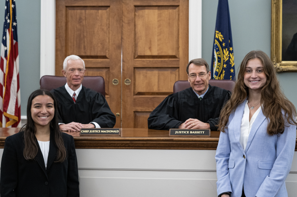 Chief Justice MacDonald and Justice Bassett with students Jessica Chiriboga '24 and Skylar Wiseman '24
