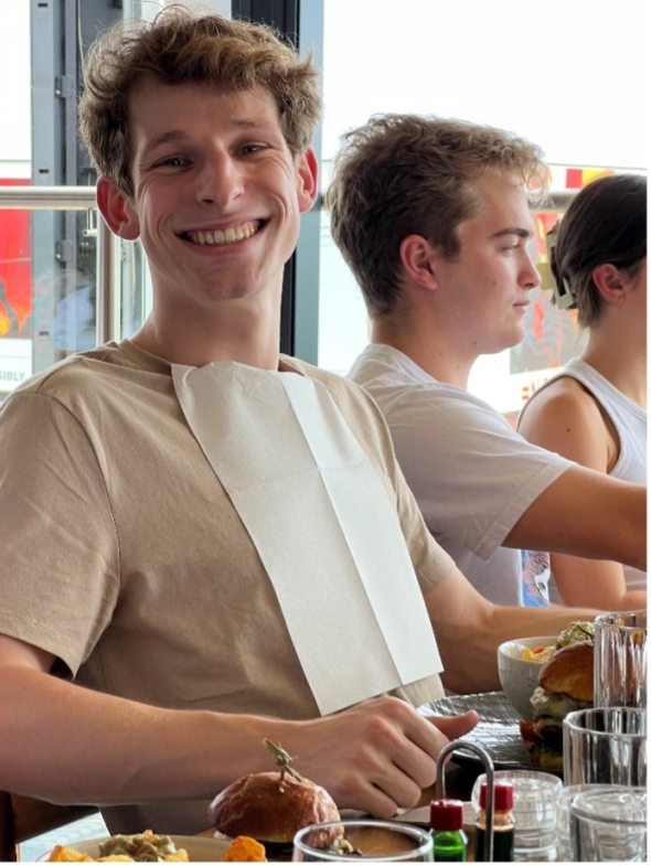Josh Freitag '23 prepares for battle with his only shirt against the double stacked burger. 