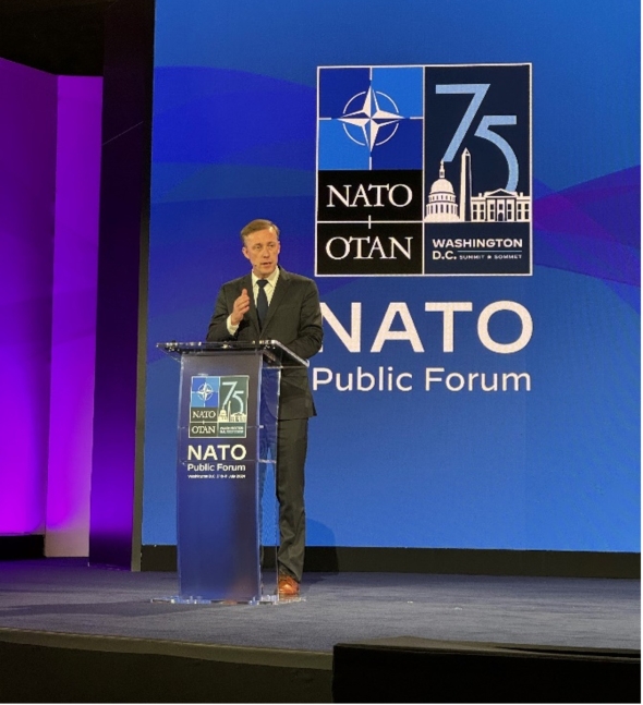 Jake Sullivan at a podium on the NATO Summit stage