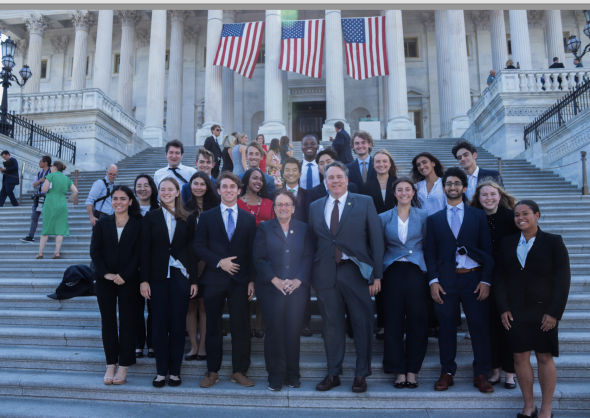 Rep. Annie Kuster '78 (D-NH) and Rep. Alex Mooney '93 (R-W.Va) with the 2023 First-Year Fellows on the steps of the U.S. Capitol